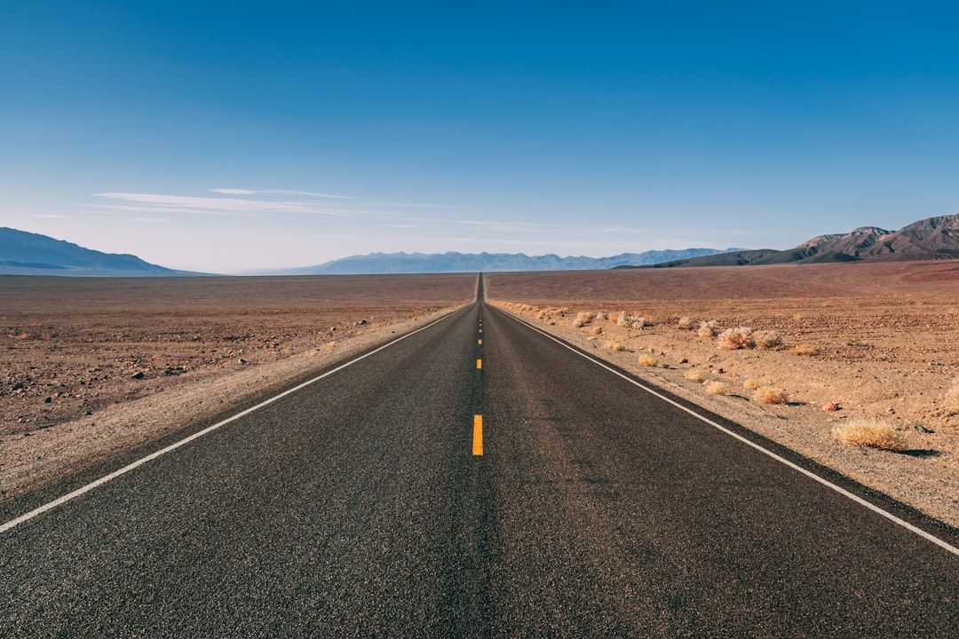 Empty desert highway US-90 running west of Marfa in West Texas at dusk